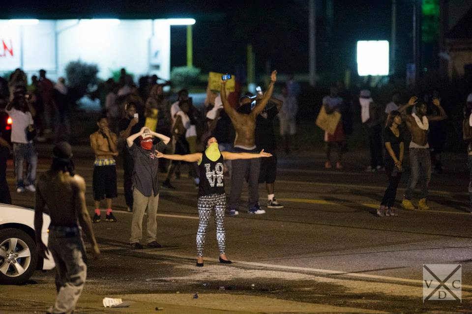 The crowds yell out to the police "Don't shoot, hands up" in Ferguson, Missouri. [Abe Van Dyke | VDC Photo]