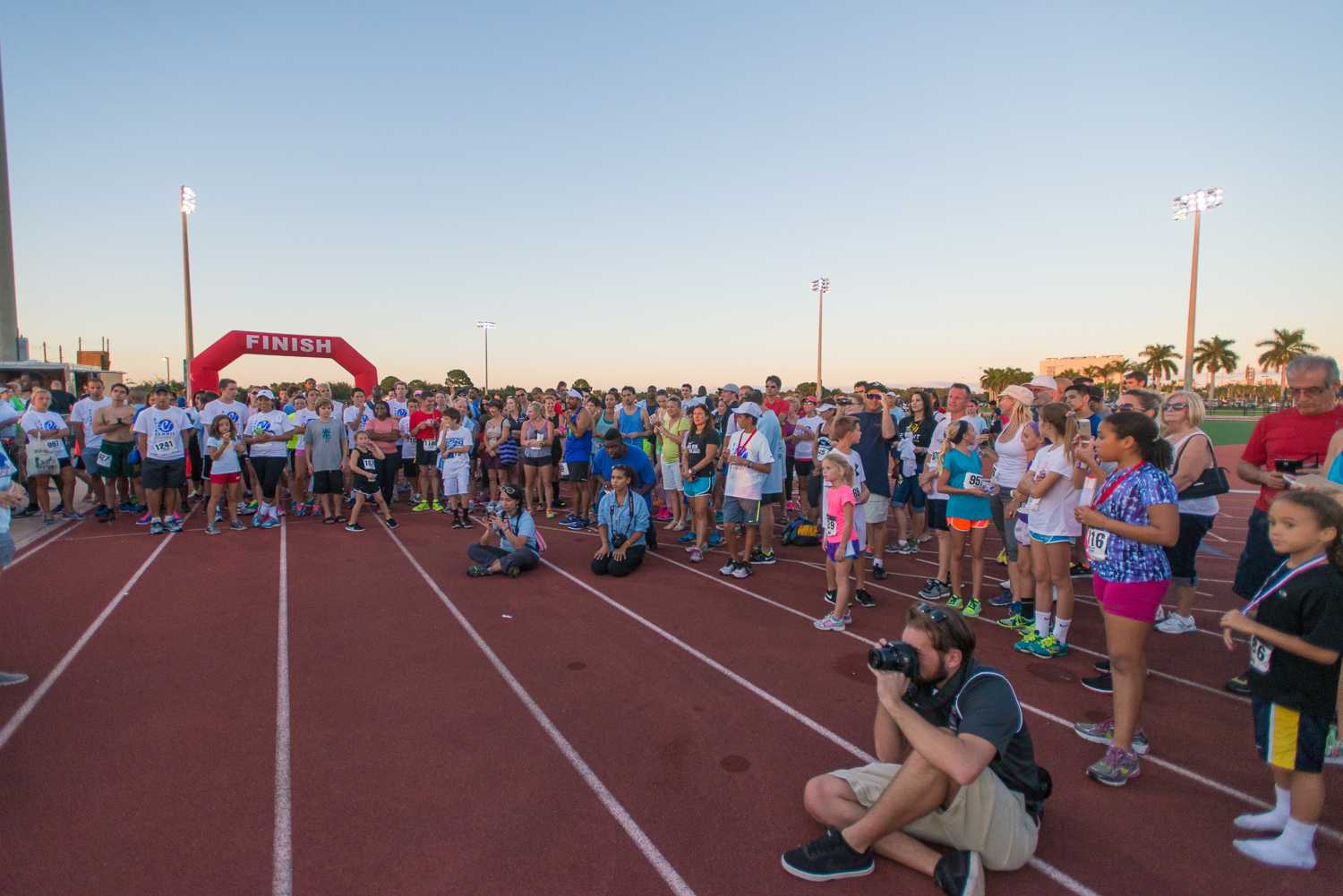 Max Jackson | Photo Editor Runners, family and friends gather at the finish line while awards are given out to the top three runners from each age category. 