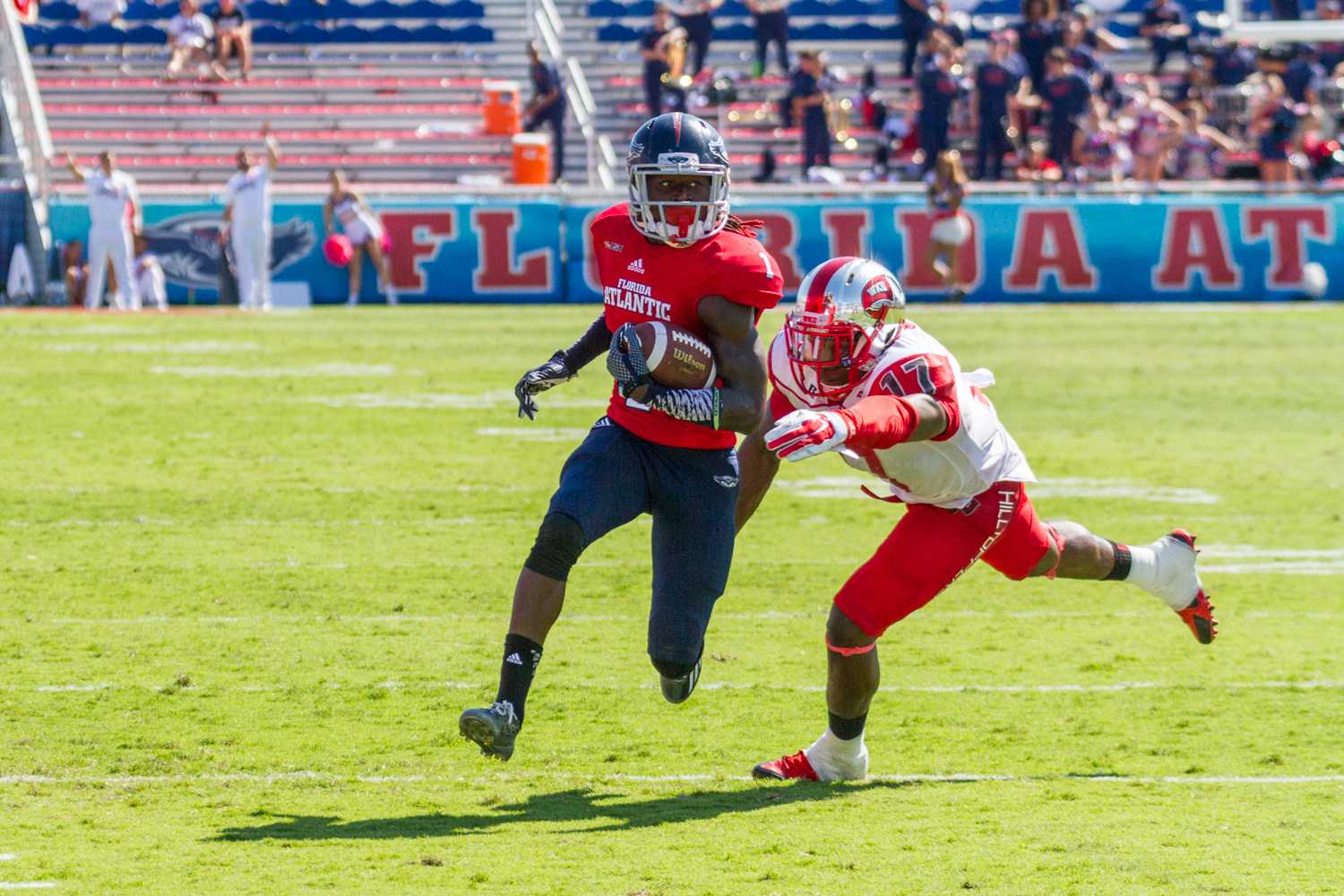 Mohammed F Emran | Web Editor  Lucky Whitehead evades a Hilltopper on his way to scoring the game-winning touchdown. 