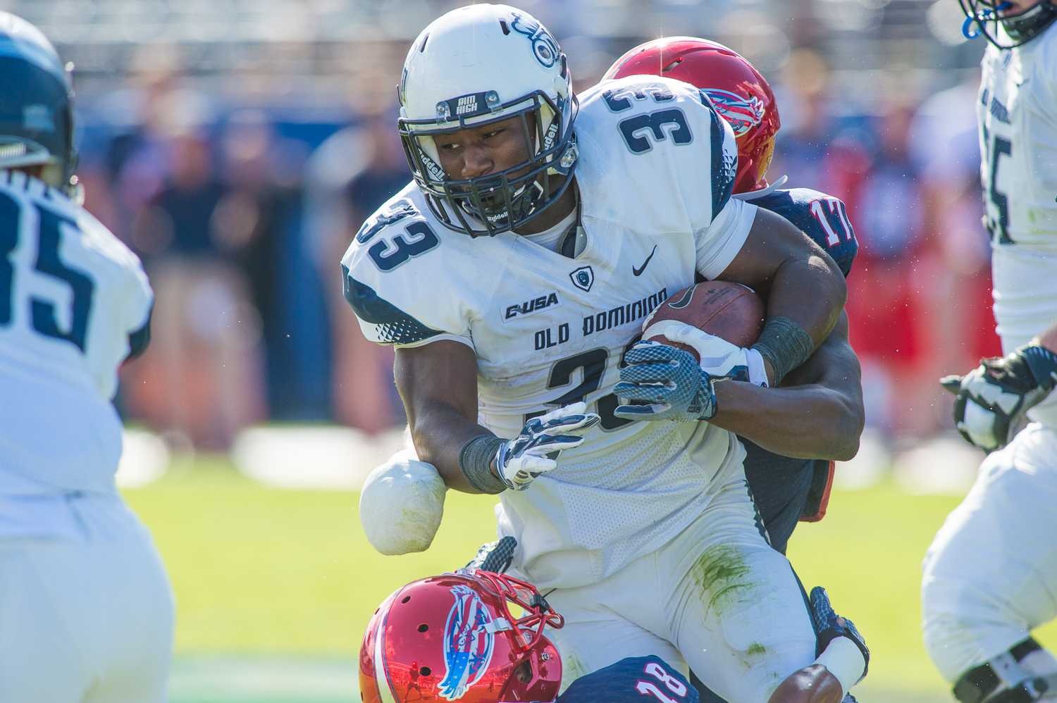 Old Dominion running back Ray Lawry tries to break free from Owls safety Damian Parms. Lawry picked up five yards on the play, and rushed for 213 yards in total. 