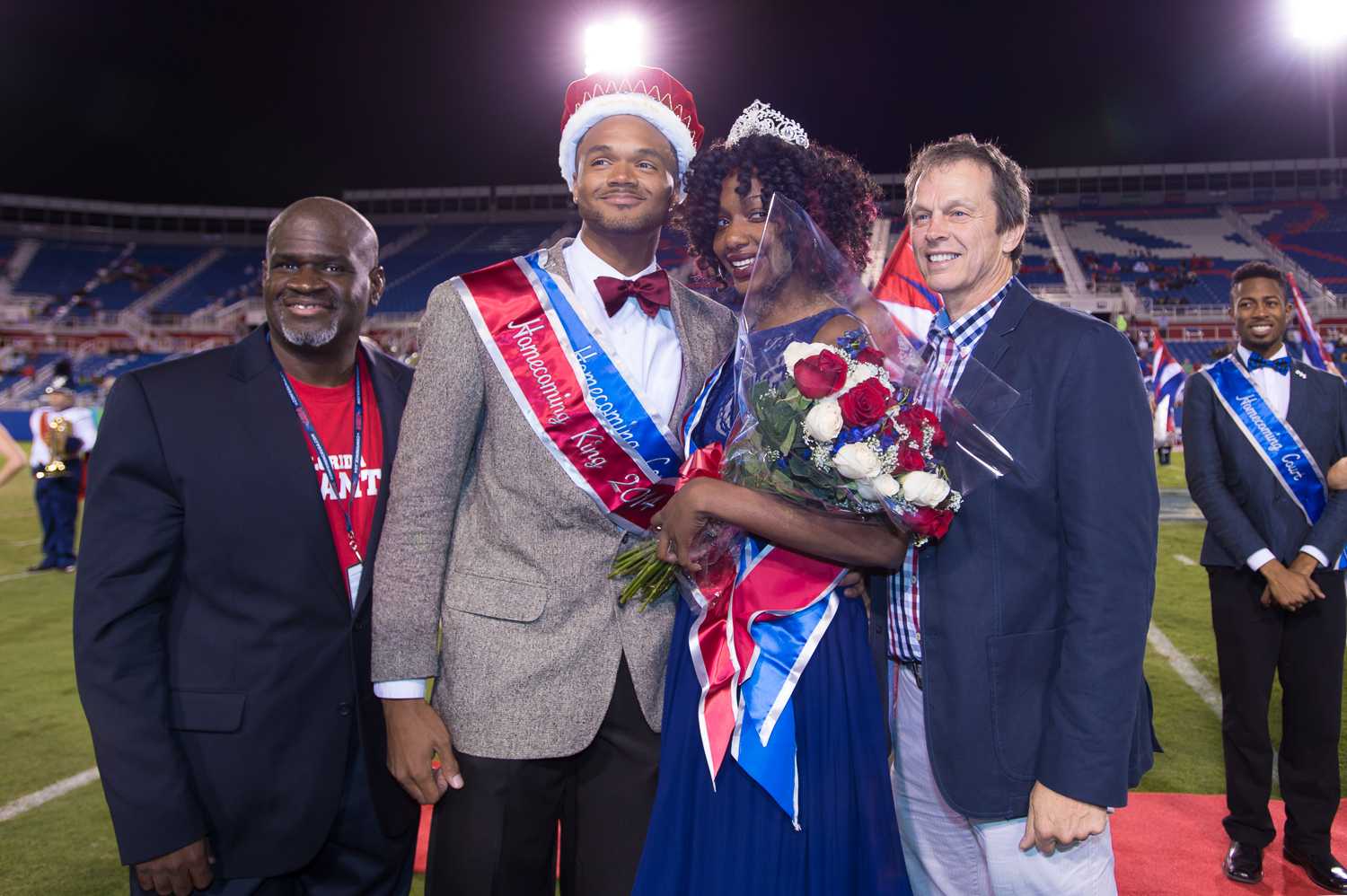 [ Max Jackson | Photo Editor ] FAU Homecoming King Byron Knight and Queen Sherrika Mitchel pose with President Kelly and Dr. King at FAU’s Homecoming game against UAB.