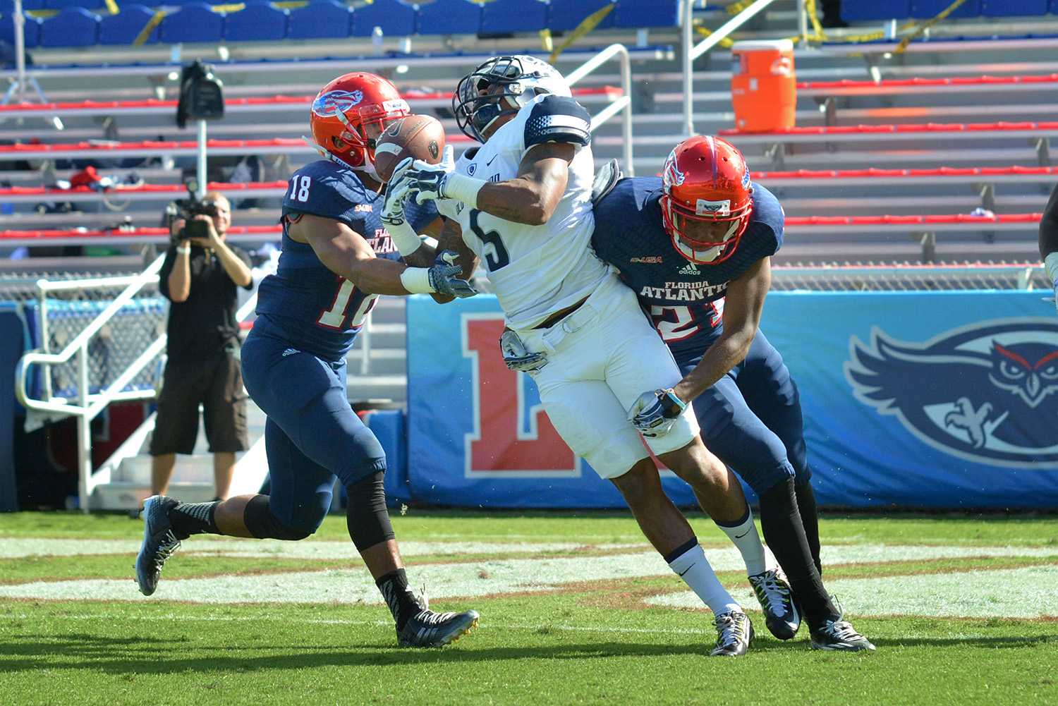 Owls senior cornerback D’Joun Smith hits Monarchs wide receiver Antonio Vaughan hard, forcing an incompletion in the second quarter during Saturday’s game. Smith tallied up 5 tackles and 2 break-ups during his final game at FAU.