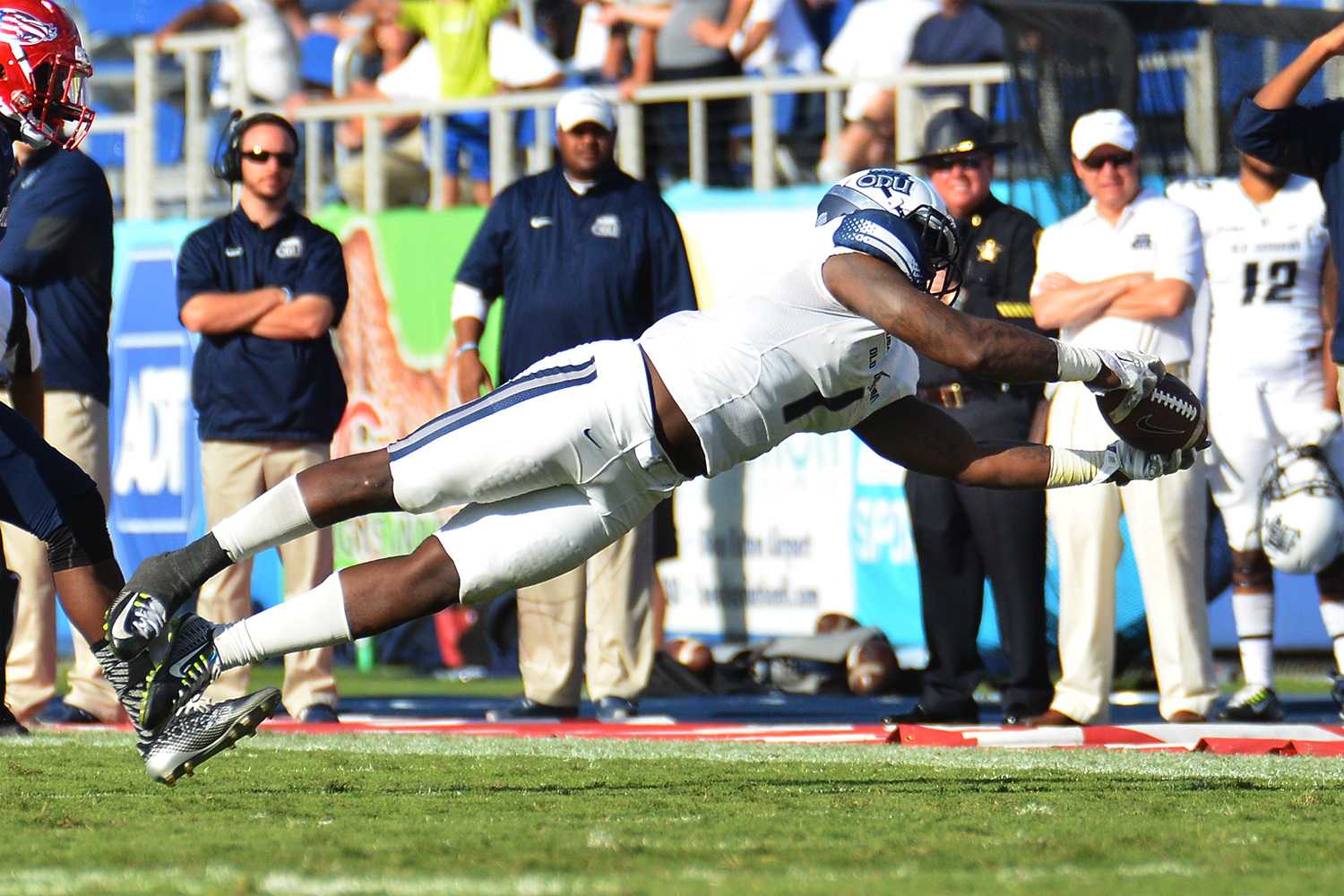 Old Dominion wide receiver Melvin Vaughn dives for a catch in the fourth quarter of Saturday’s game between the Owls and Monarchs. 