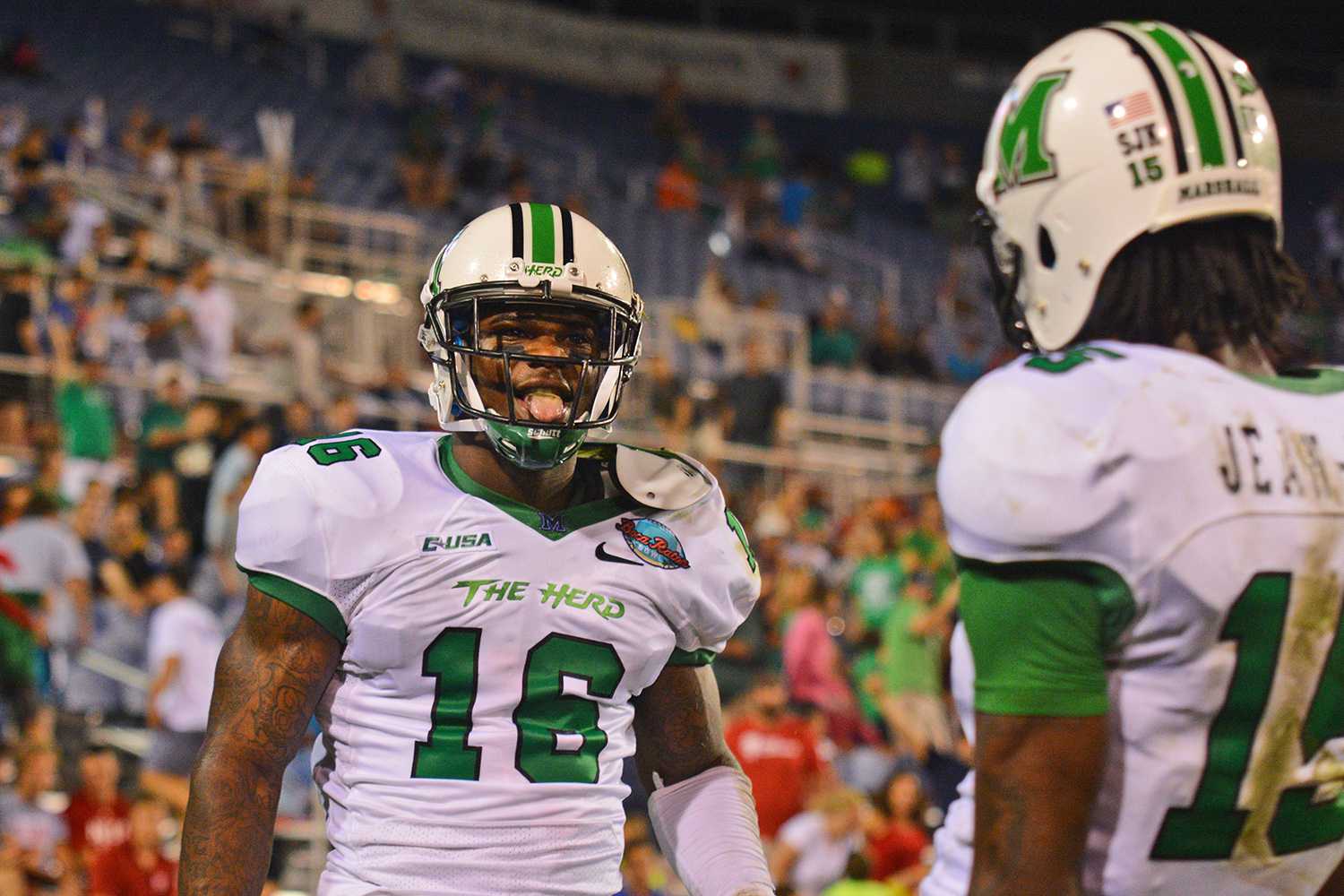 Deon-Tay McManus celebrates with Angelo Jean-Louis after he (McManus) scored a touchdown. McManus, a wide receiver from Baltimore, caught a 27-yard pass from Marshall QB Rakeem Cato, and after the extra point, the score stood at 45-20 in favor of the Thundering Herd. 