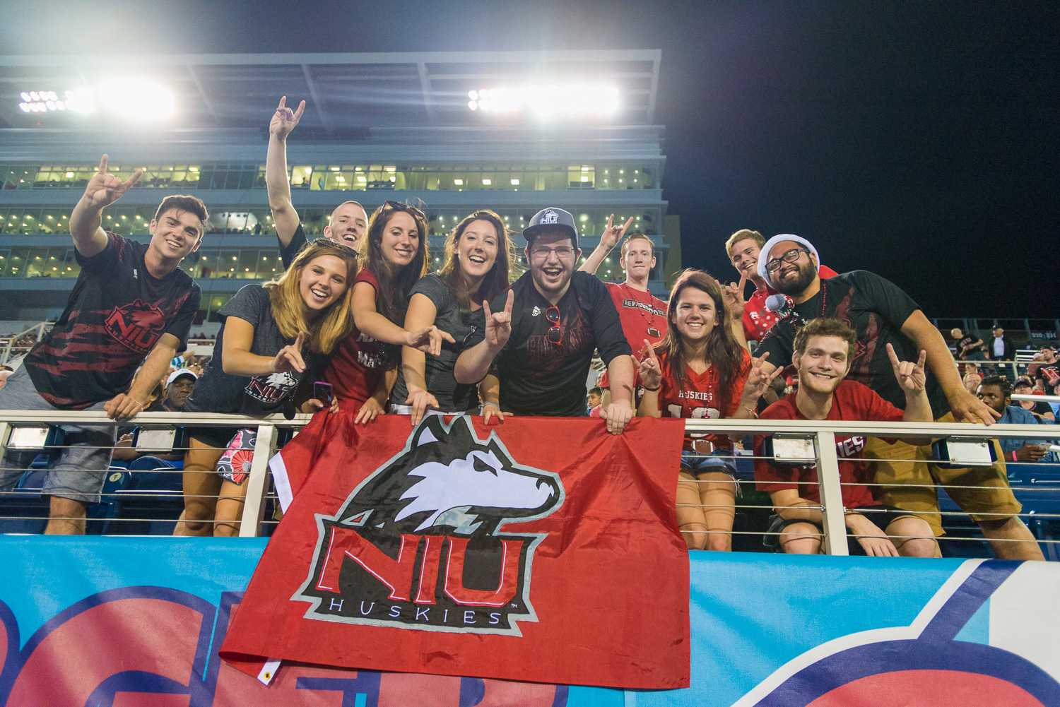 Northern Illinois Huskies fans cheer on their team in the first-ever Boca Raton Bowl on Tuesday evening, Dec 23.  The high in Dekalb on game day was 46.1 degrees, while the high in Boca Raton was 80.4 degrees. 