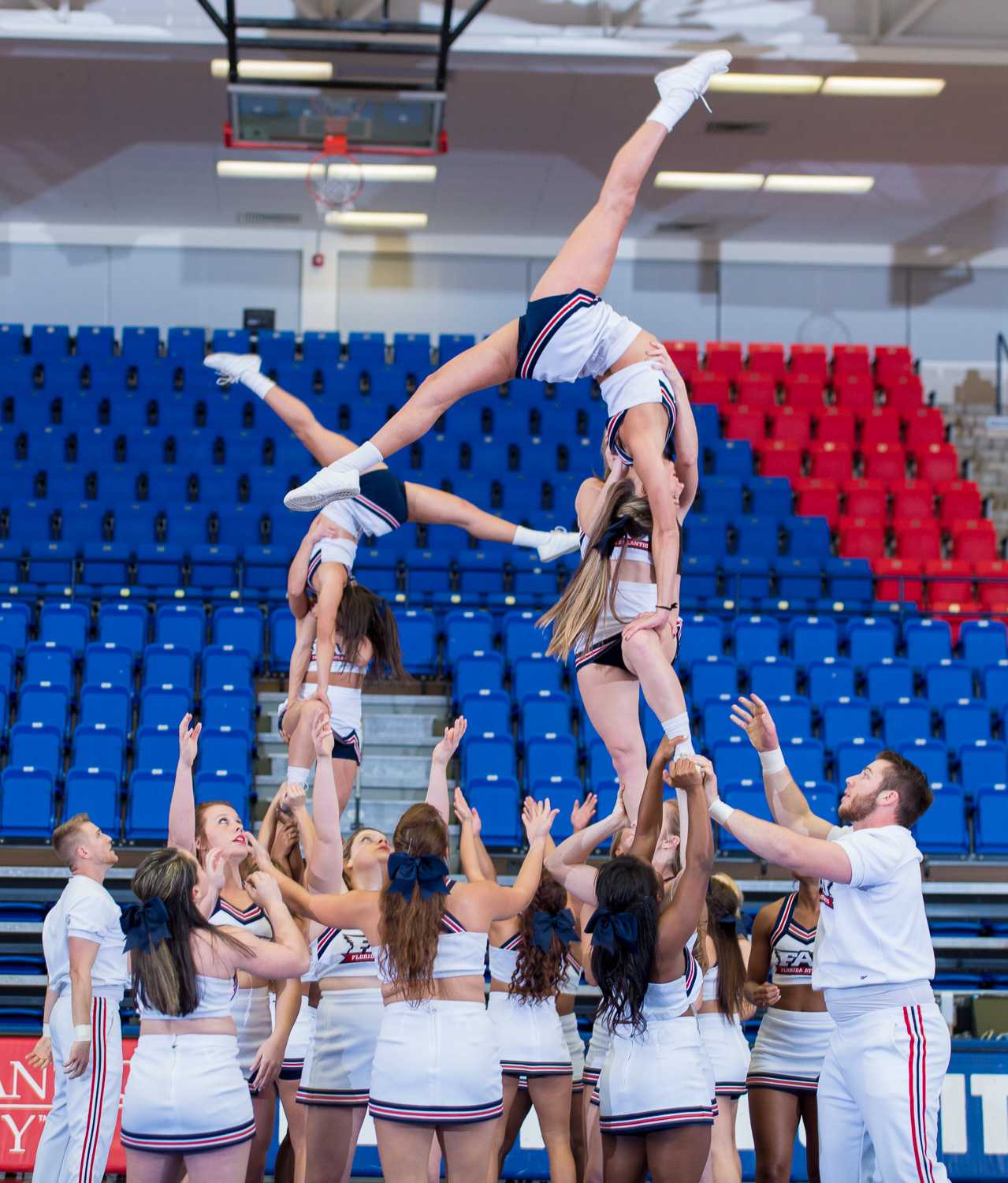 The FAU Cheerleaders show off a pyramid at the 2015 FAU Dance Team Showcase in The Burrow. 