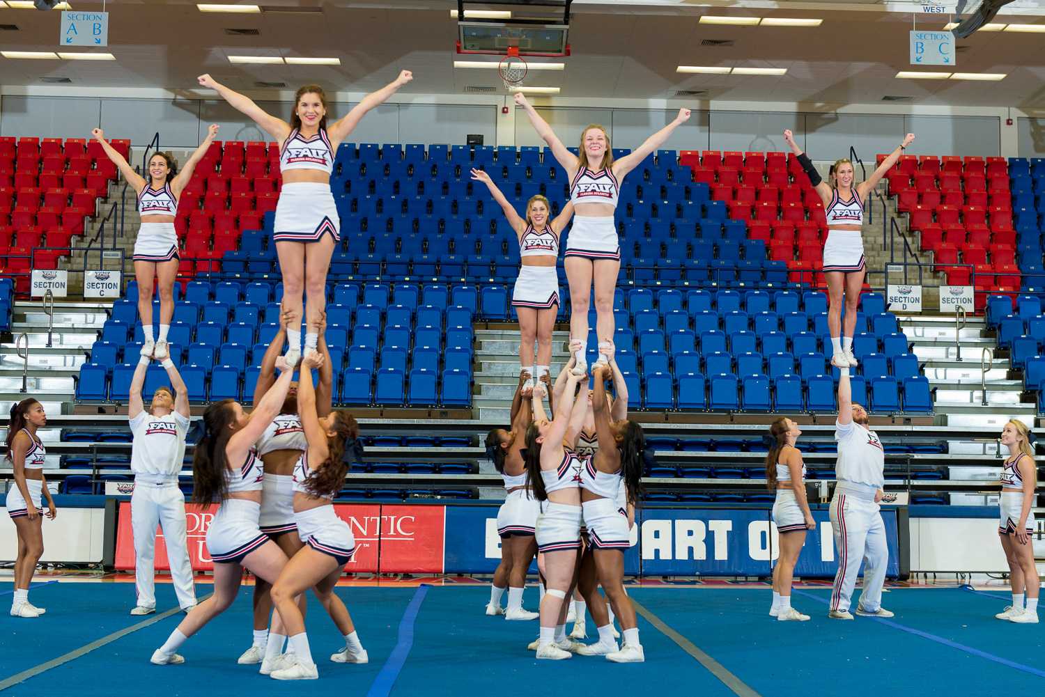 FAU Cheerleaders perform an extension ( left four) and a cupie (right) at the 2015 FAU Dance Team Showcase. 