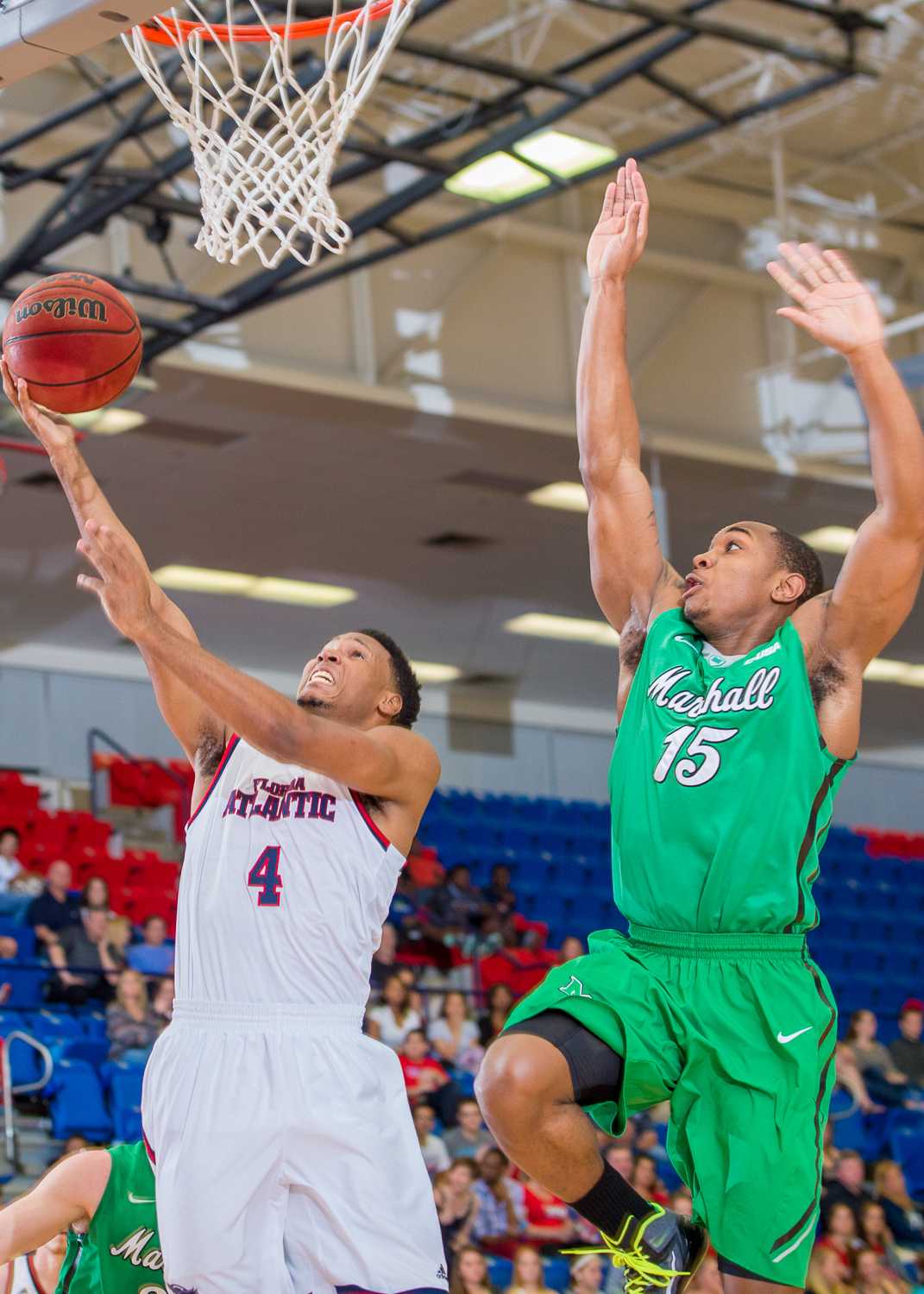 Massey (4) attempts a layup after FAU’s defense stole the ball from Marshall.  Massey scored five points on the day.