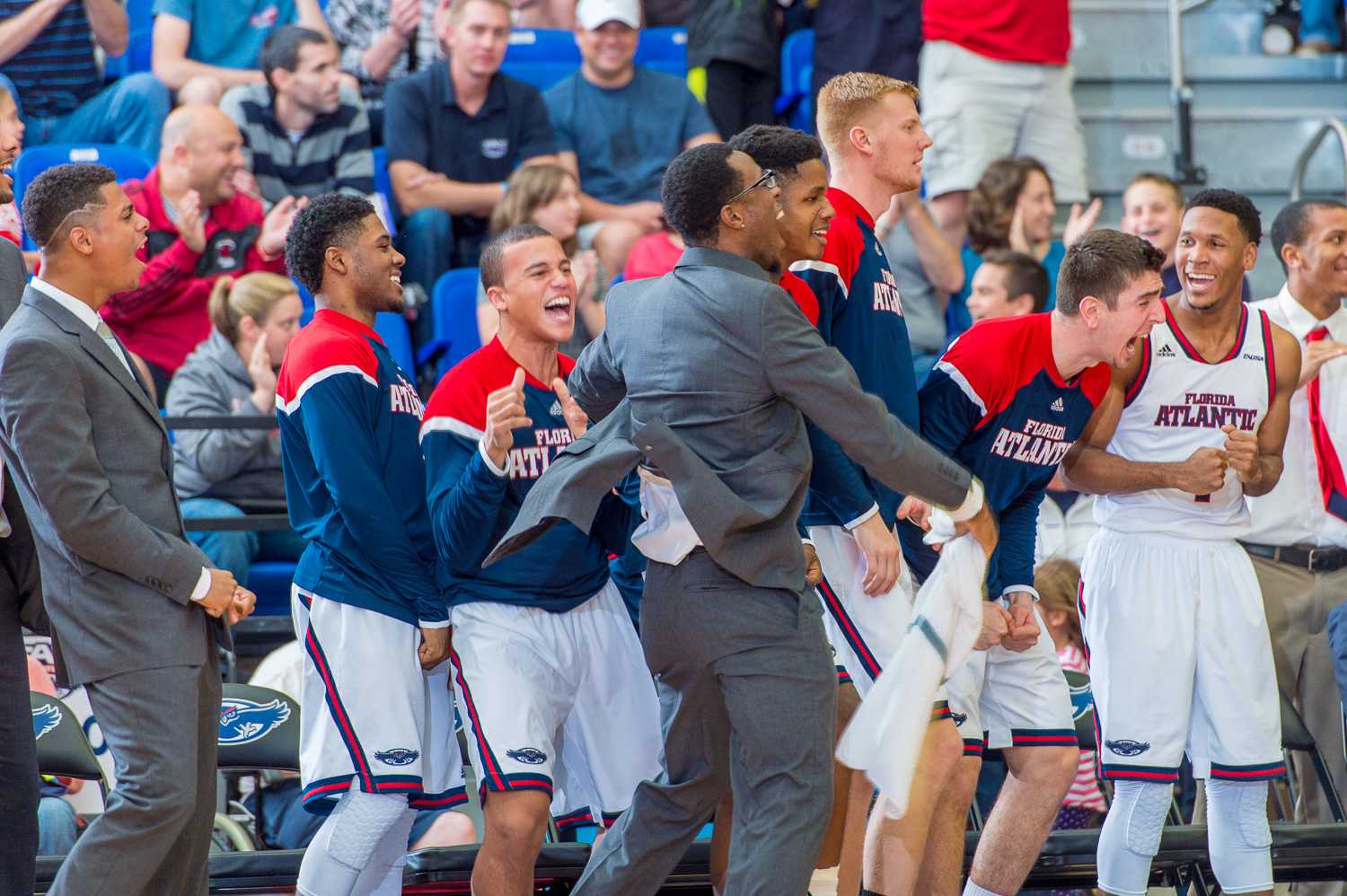 The FAU bench jumps up and cheers after their first conference win over Marshall is secured. 