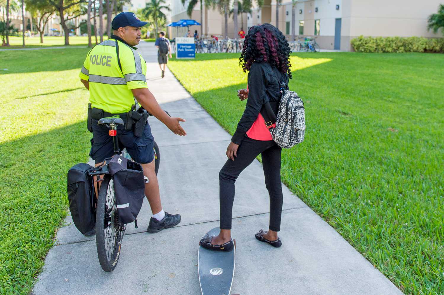  An officer of the FAU PD stops a student who would not get off of her longboard while in the breezeway. 