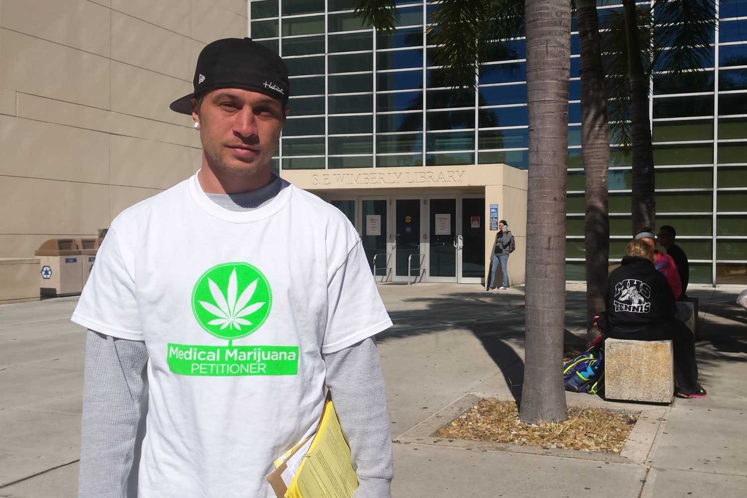 Mike McSherry collects signatures for petitions to place medical marijuana and solar power initiatives on the 2016 election ballot in Florida. Photo by Dylan Bouscher | Contributing Photographer