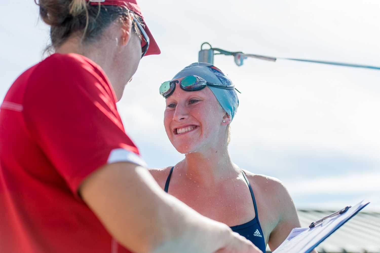 FAU’s Abbey King celebrates with her coach after winning the women’s 1000 yard freestyle event with a time of 10:27.01. 