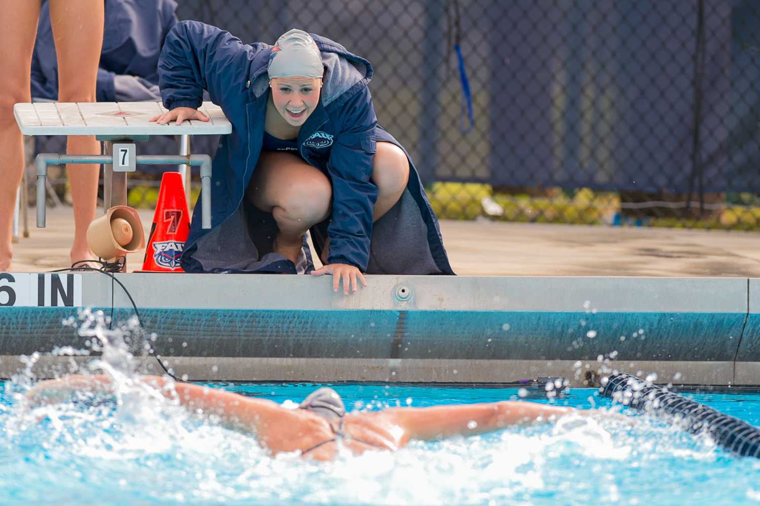 Sahra El-Hamaki cheers on her teammate in the final stretch of the women’s 200 yard butterfly.