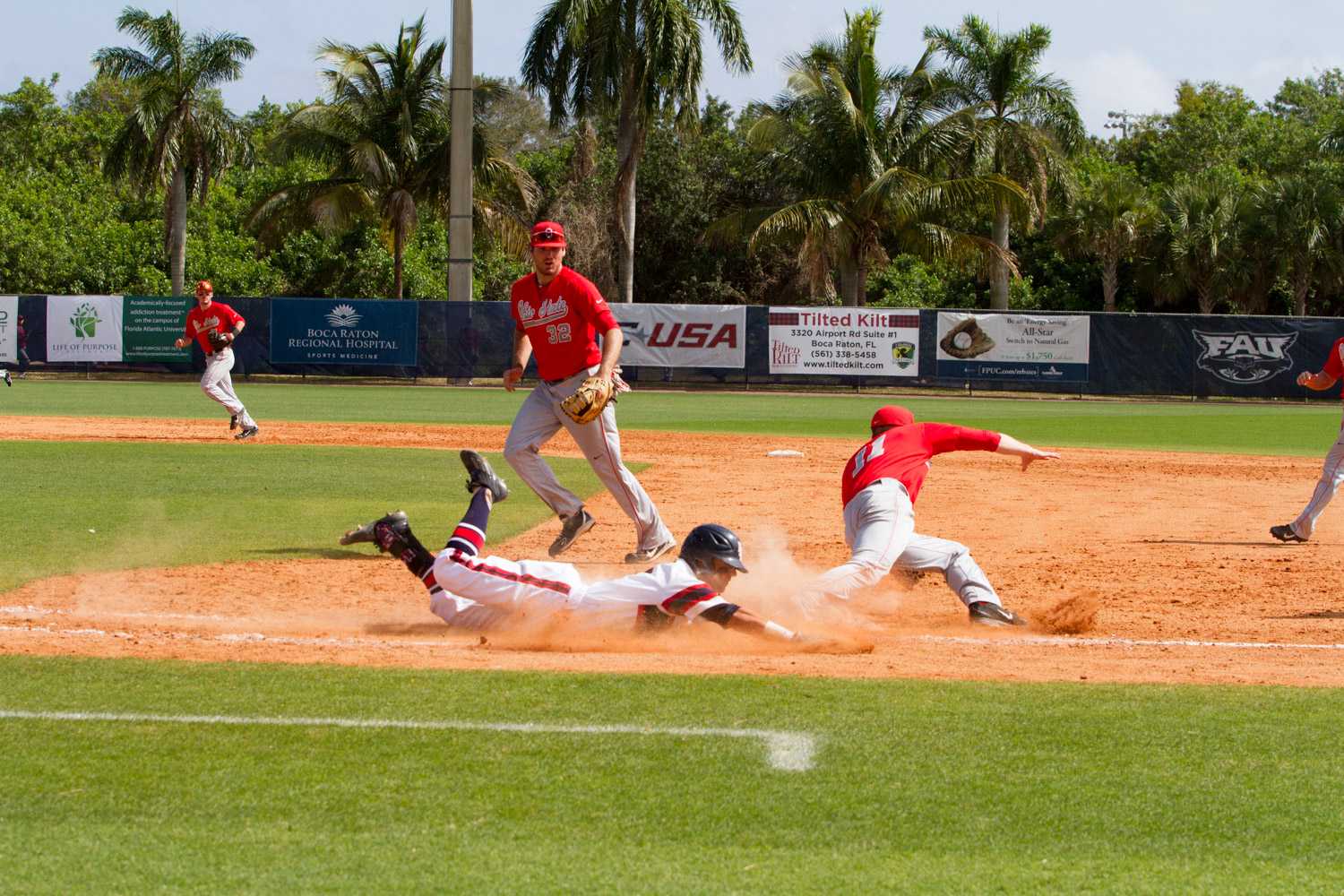 Sophomore Stephen Kerr (6) slides into first safely after an Ohio State error.