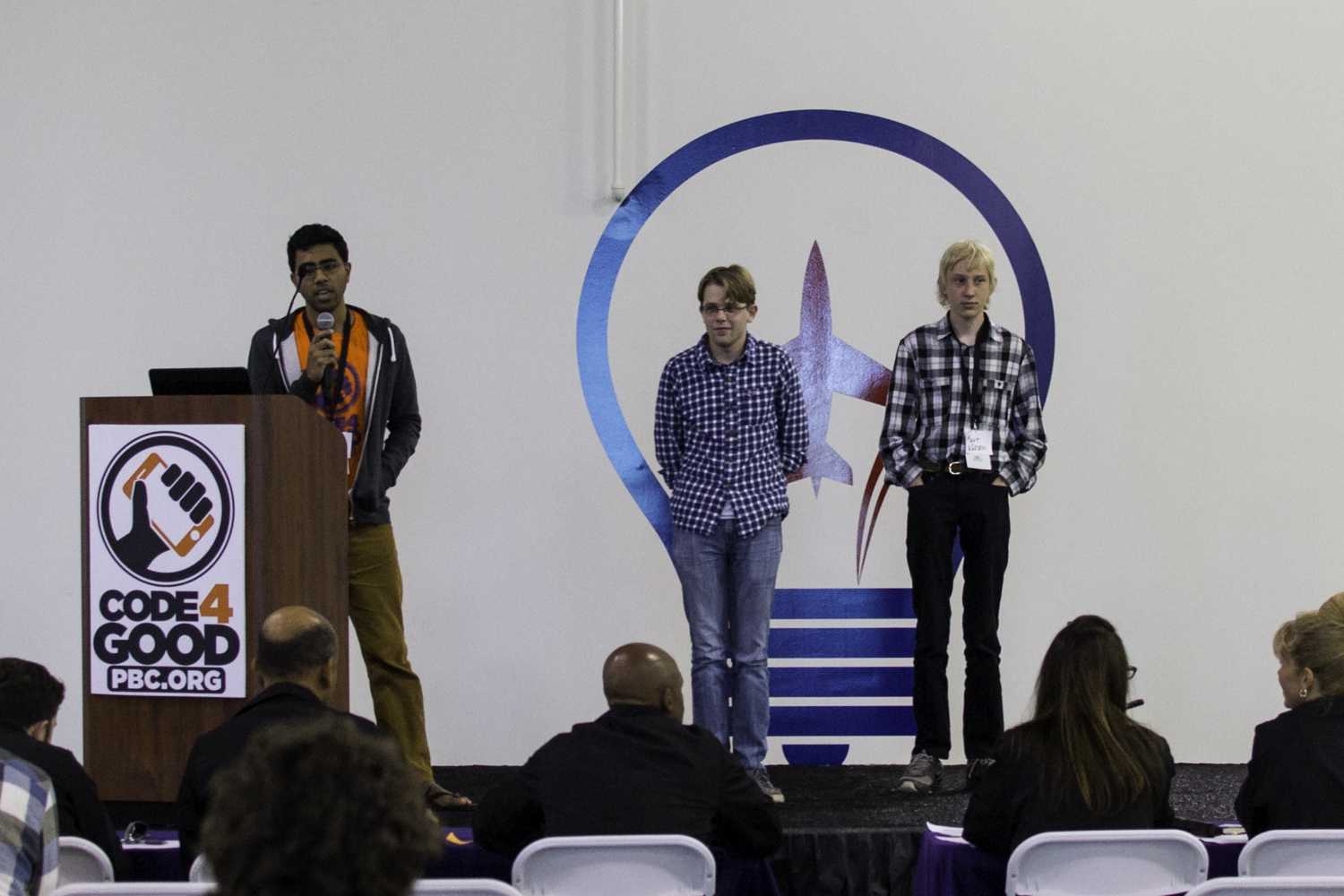 First place winners: Aton, Rohan, and Kurt team “TechGarage” give their 5 minute presentation to the judges. Photo by Alexis Hayward | Web Assistant 