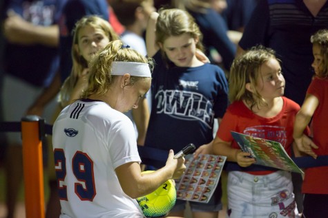 FAU junior defender Kelsey Parry (29) signs autographs for Owls fans after a 3-1 win against the University of Miami. Photo by Brandon Harrington| Contributing Photographer