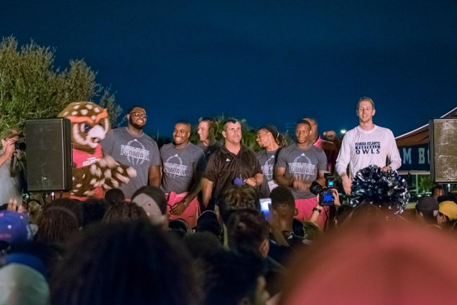 Coach Charlie Partridge speaks at the bonfire rally with the football team. Mohammed F Emran | Staff Photographer