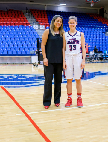 Women's basketball head coach Kellie Lewis-Jay (left) and sophomore guard Nika Zyryanova (right) pose for a photo after a 79-64 win against Barry University. Mohammed F. Emran | Asst. Creative Director