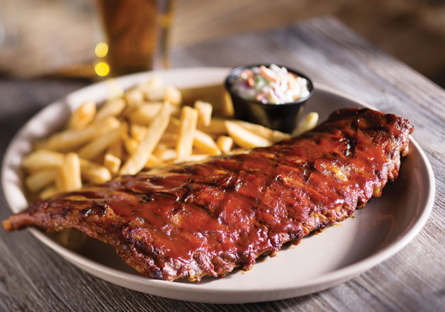 Baby back ribs are one of Miller’s Ale House’s house favorites. Slow cooked with the restaurant’s secret recipe, these ribs are covered in Southern barbecue sauce with coleslaw and a side. Photo courtesy of Miller’s Ale House’s website.