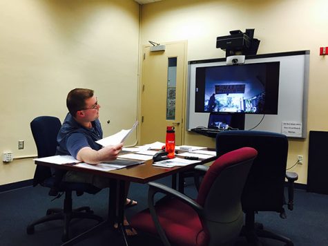 Ryan Klimar, the marketing director for the Elections Board, video chats with Gregory Barber as they sort through contestations. Photo by Gregory Cox | Managing Editor