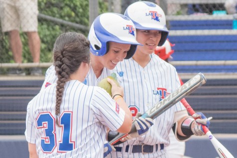 Anna Cross kisses her team’s luck charm- a fake baby gator in an egg - after hitting a home run in the top of the fourth inning Sunday. The senior rightfielder had Louisiana Tech’s only hit and run of the game. Ryan Lynch | Multimedia Editor