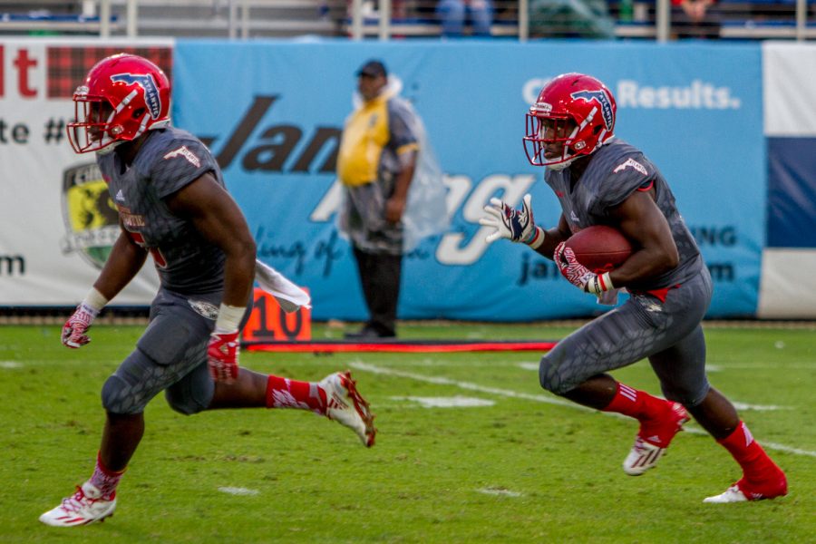 Redshirt freshman Kerrith Whyte runs after receiving a Hilltopper kickoff while freshman Devin Singletary (5) runs ahead to block defenders. Jonathan Scott | Contributing Photographer