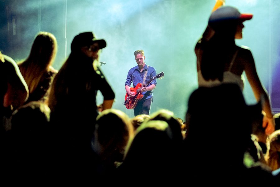 Chase Bryant’s guitarist performs while Bryant sings during the 2016 Bonfire concert Monday. Mohammed F Emran | Contributing photographer