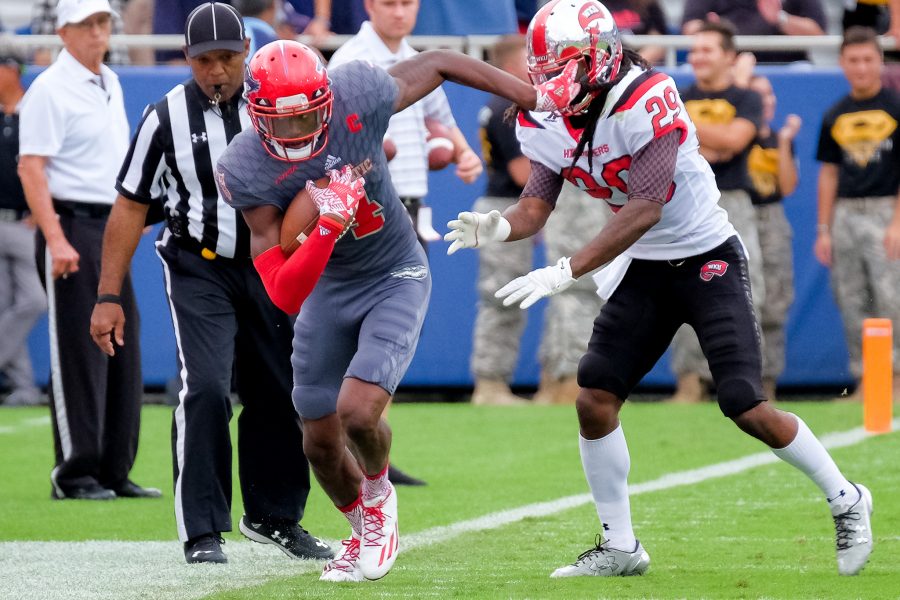 Hilltoppers junior strong safety Leverick Johnson (29) pushes Owls redshirt junior wide receiver Kalib Woods (4) out of bounds. Mohammed F Emran | Staff Photographer