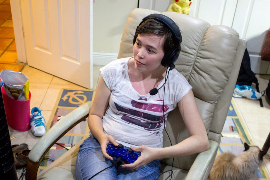 Console gamer and senior elementary education major Jamie Kapp playing Mass Effect 3 online on her Playstation 3 at home. Andrew Fraieli | Managing Editor
