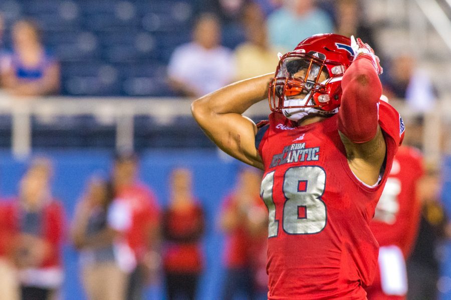 FAU sophomore safety Jalen Young (18) reacts after dropping a punt, which resulted in UTEP regaining possession of the ball. Max Jackson | Staff Photographer