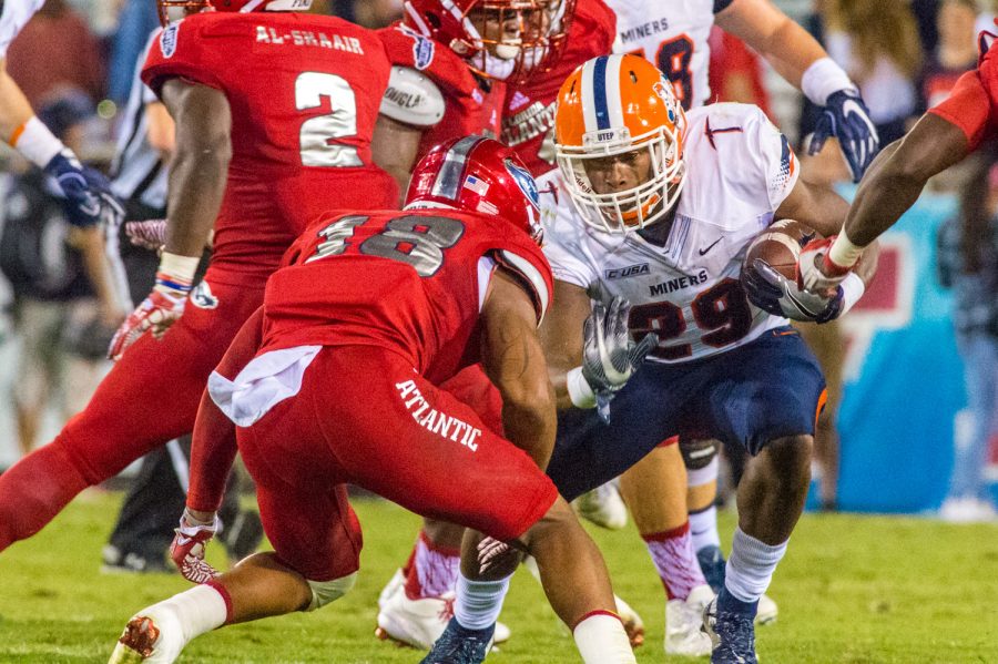 UTEP running back Aaron Jones (29) eyes up Owls safety Jalen Young (18) before being tackled. Max Jackson | Staff Photographer