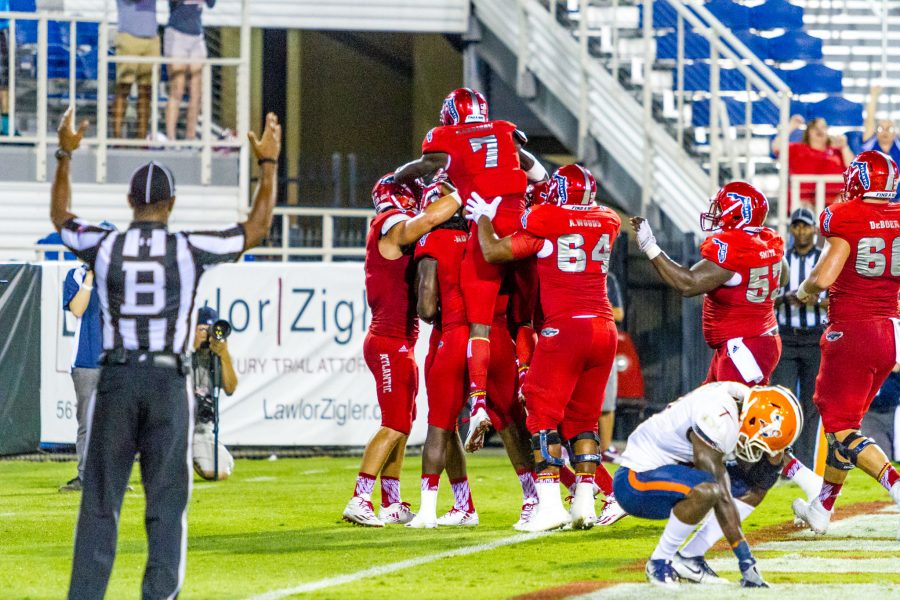 FAU players celebrate in the endzone after the game-winning touchdown by Nate Terry. Alexis Hayward | Contributing Photgrapher