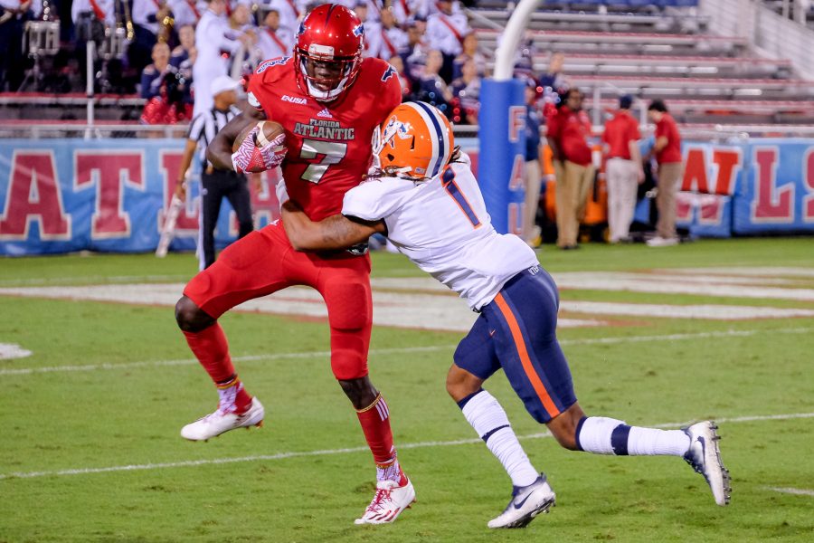 FAU wide receiver Tavaris Harrison (7) is tackled by UTEP defensive back Kalon Beverly (1) at the 7 yard line. Mohammed F Emran | Staff Photographer