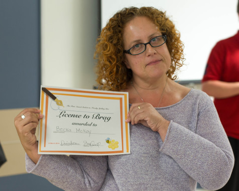 Winner of the Spelling Bee Professor Becka McKay poses with her award. Photo by Kiki Baxter.