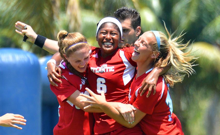 Alex Mastrobuono, Yazmin Ongtengco, and Amanda Odato celebrate after Ongtengco scored FAU’s first goal in the 28th minute. [Ryan Murphy|Business Manager]