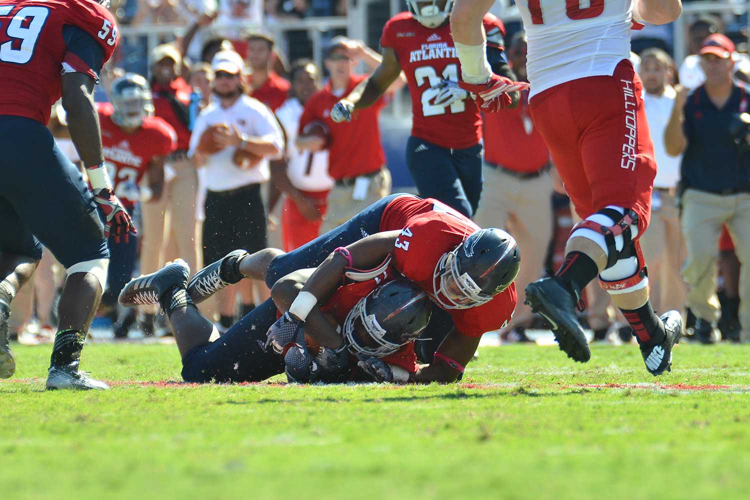Ryan Murphy | Business Manager Trevon Coley recovers a fumble by WKU quarterback Brandon Doughty in the final minute of the game. 