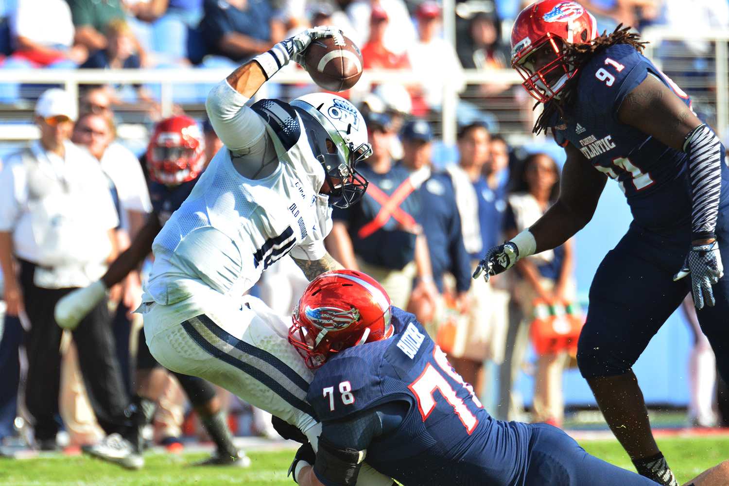 Monarchs quarterback Taylor Heinicke is sacked by Owls left tackle Derek Butcher. Heinike threw for 282 yards and 3 touchdowns during ODU’s victory over FAU Saturday afternoon. 