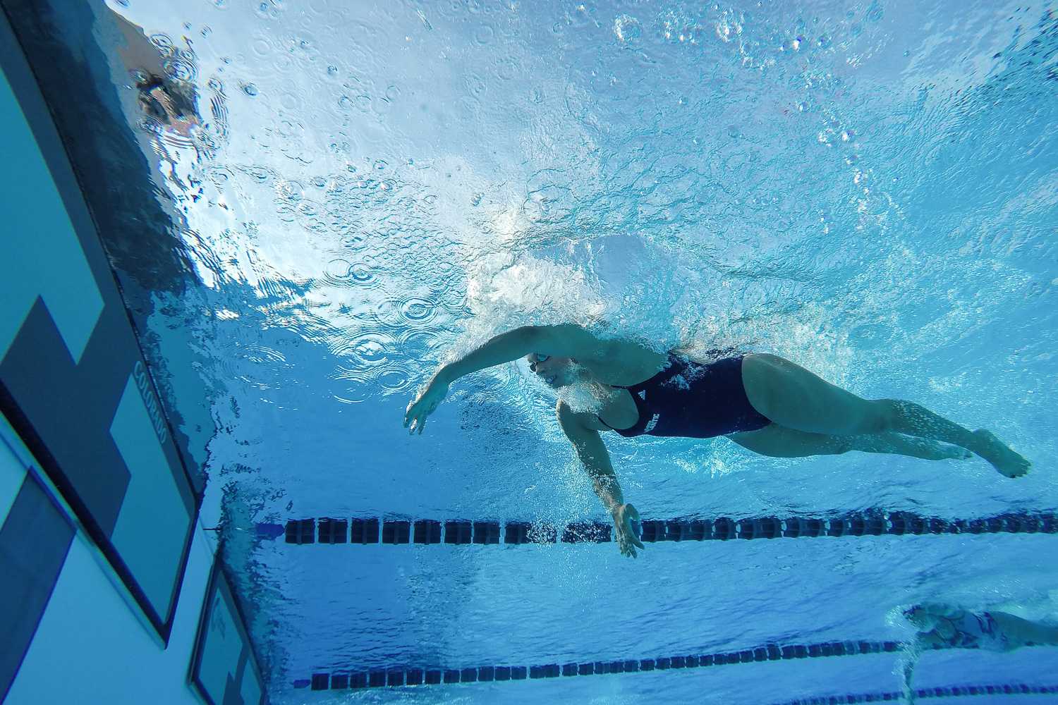 An FAU swimmer prepares to turn as she nears the wall in the freestyle. 