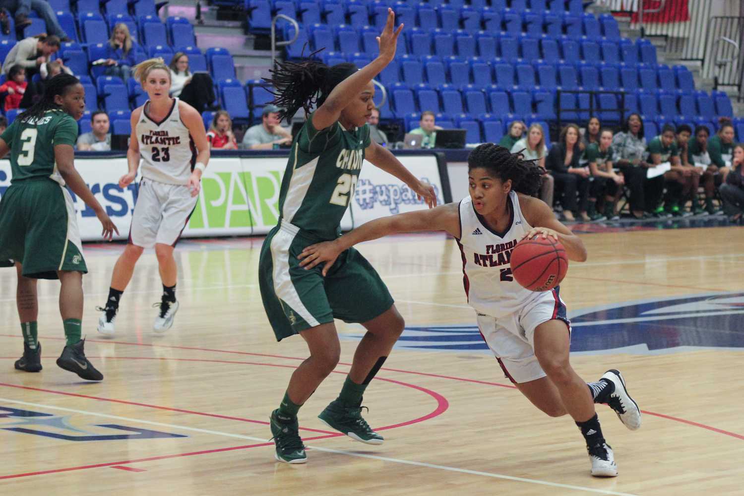 FAU guard Shaneese Bailey (2) drives toward the basket around Charlotte forward Kira Gordon. Bailey finished with 10 points in a 71-68 win over Charlotte on Jan. 29. 