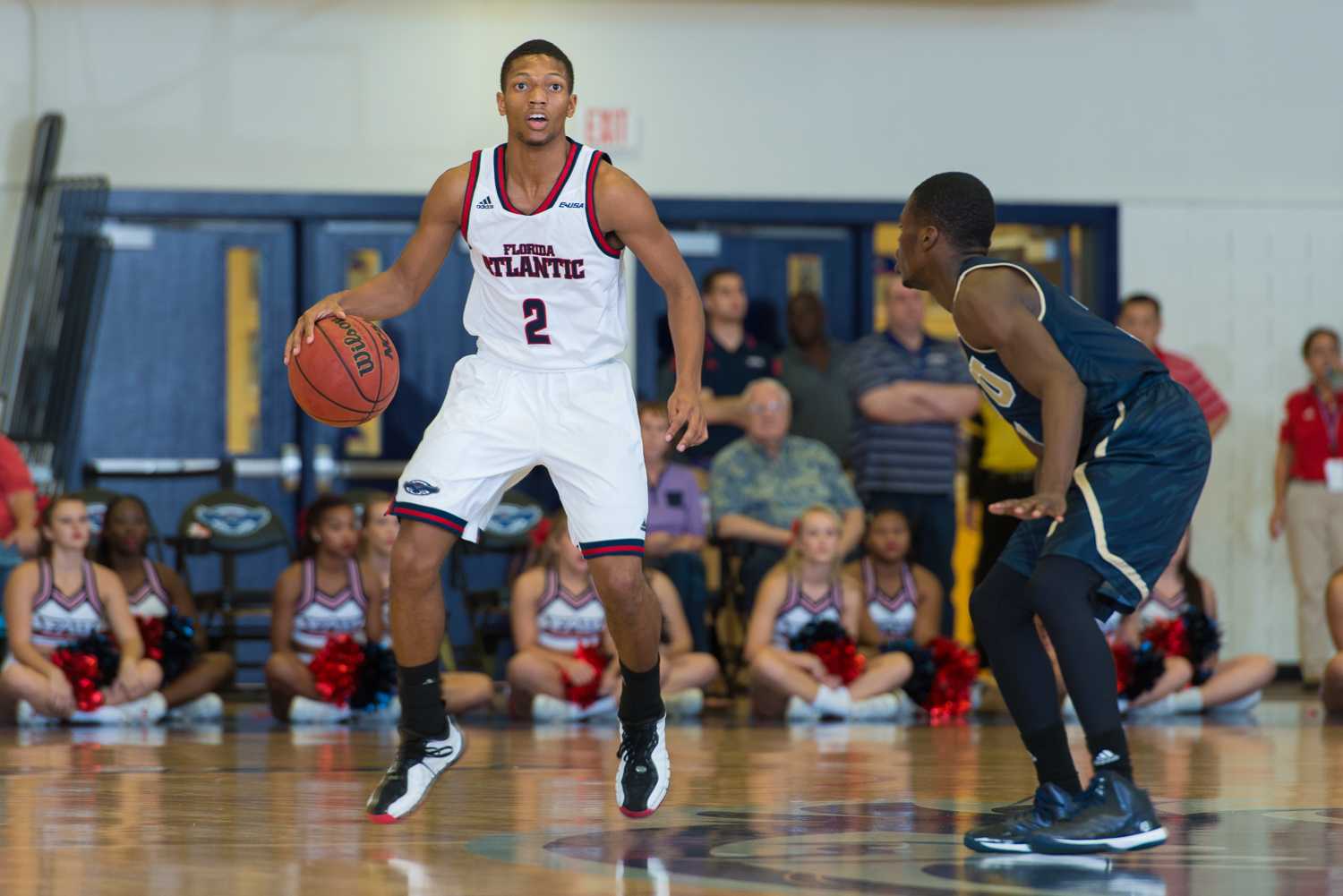 FAU point guard Marquan Botley (2) dribbles up the court looking to to make a play in the first half.  