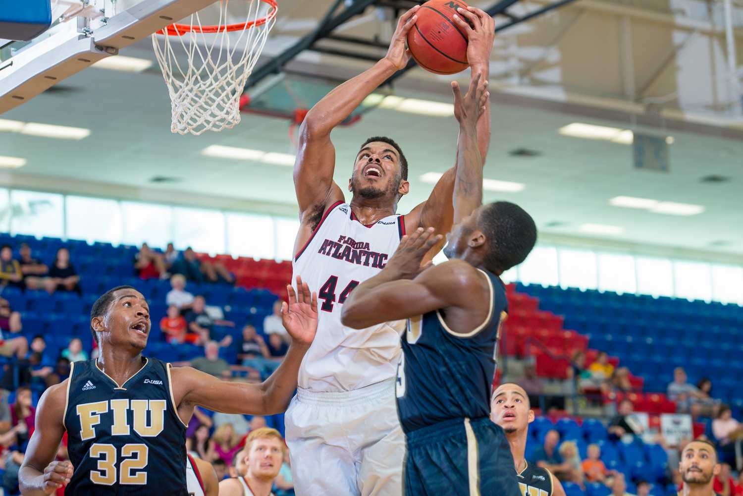  FAU forward Kelvin (44) Penn grabs a rebound as Panthers center Michael Phillip attempts to gain possession. 