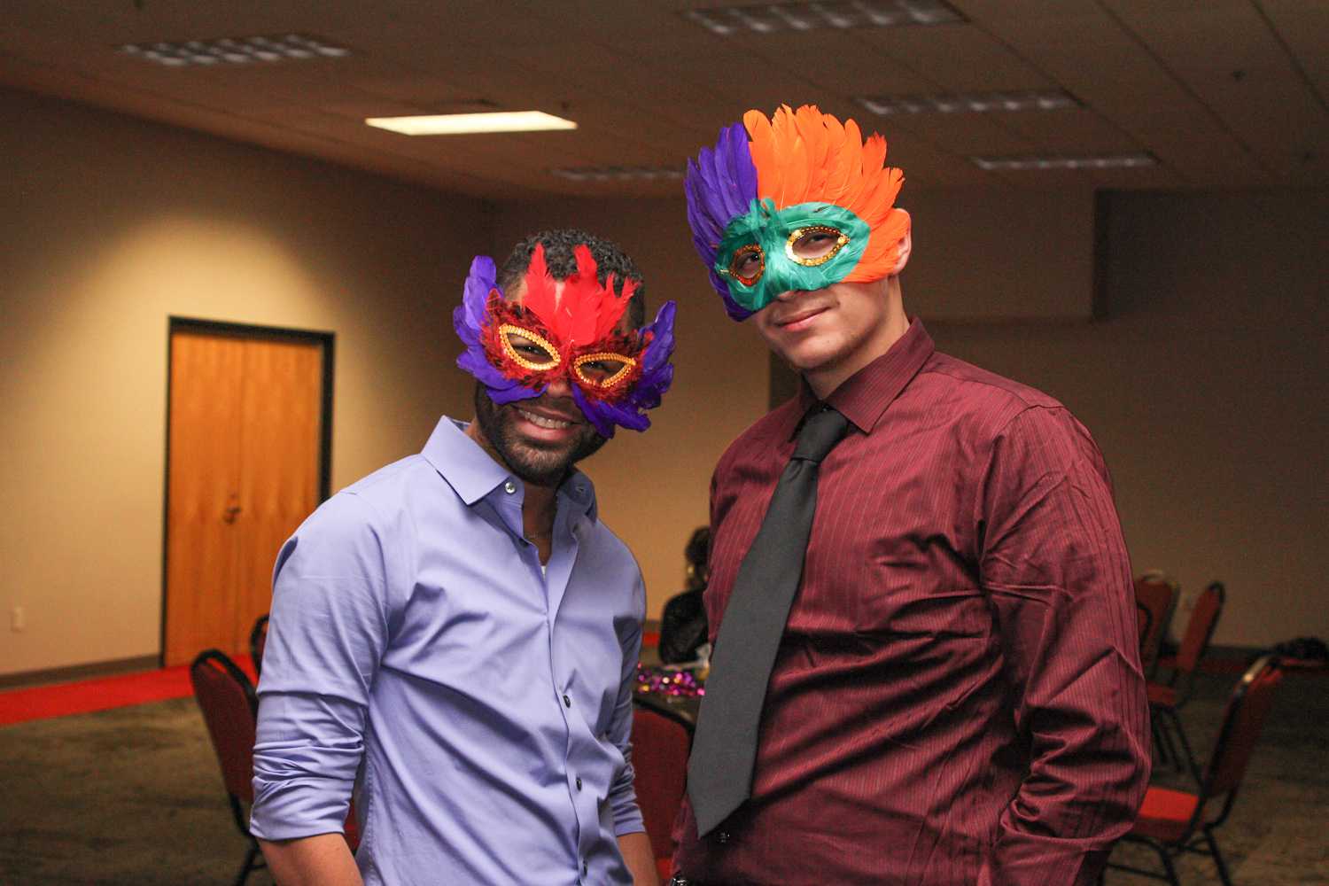 Donning colorful masquerade masks, Milor Perdomo, a junior political science major, and Ricardo Torres, a sophomore criminal justice major, pose for a photo at the LGBTQA Gala held on Friday Jan 30, in FAU’s Boca Student Union. 