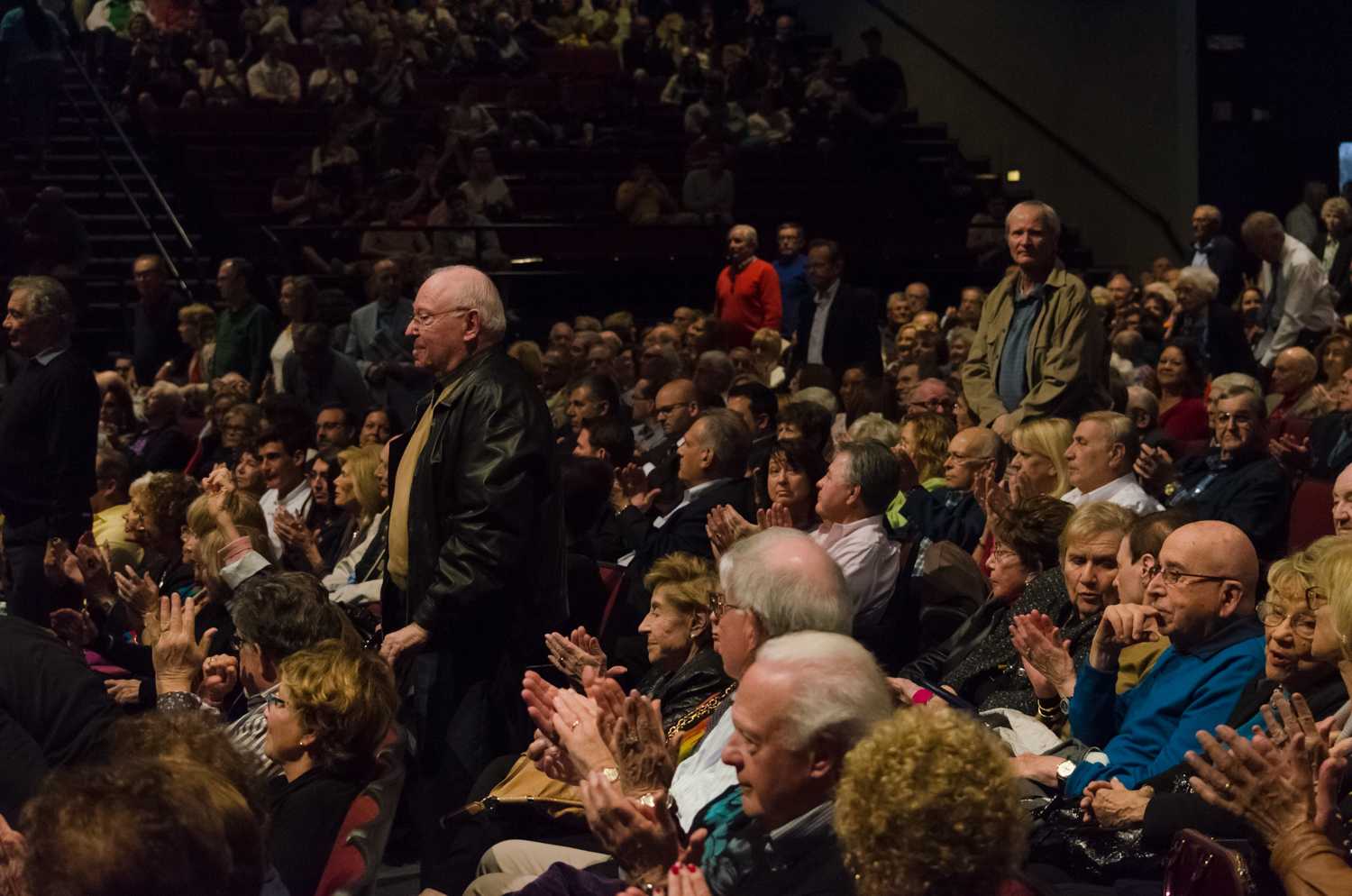 Veterans and spouses of veterans stand so they could be acknowledged for their services before the lecture began. Tim Murphy | Assistant Photo Editor