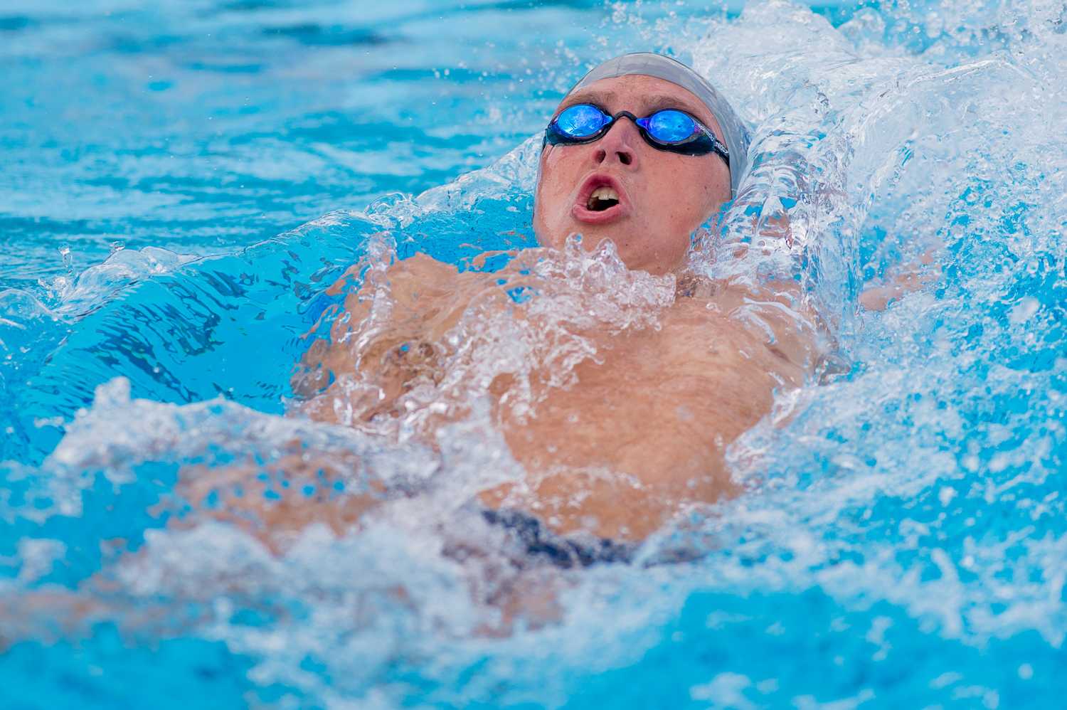 John Brennock of FAU starts the men’s 200 yard backstroke.  Brennock placed third on the event with a time of 52.11.