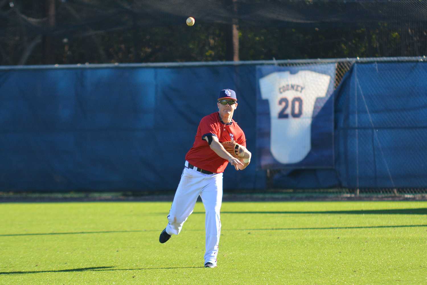 Junior outfielder Brendon Sanger tosses a ball back after making a catch in the second game. Sanger went hitless in two at-bats in the second game against the  Huskies. 