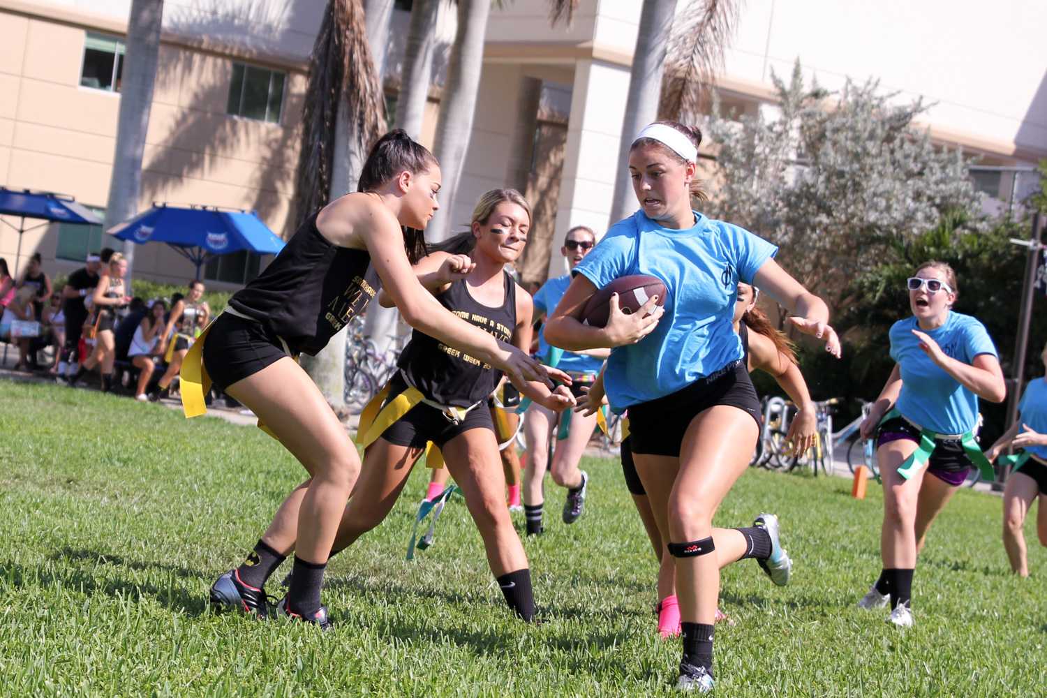 Phi Mu member tries to break past Alpha Xi Delta members during the Greek Games on Friday March 20th. 