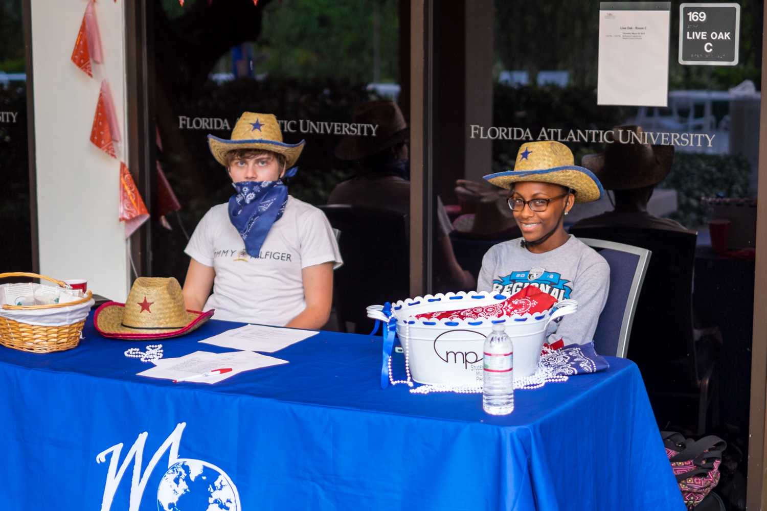 Onur Basman (political science) and Nia Awonsa (marketing) volunteering for Multicultural Program Board by greeting students into the event. Mohammed F Emran | Web Editor  