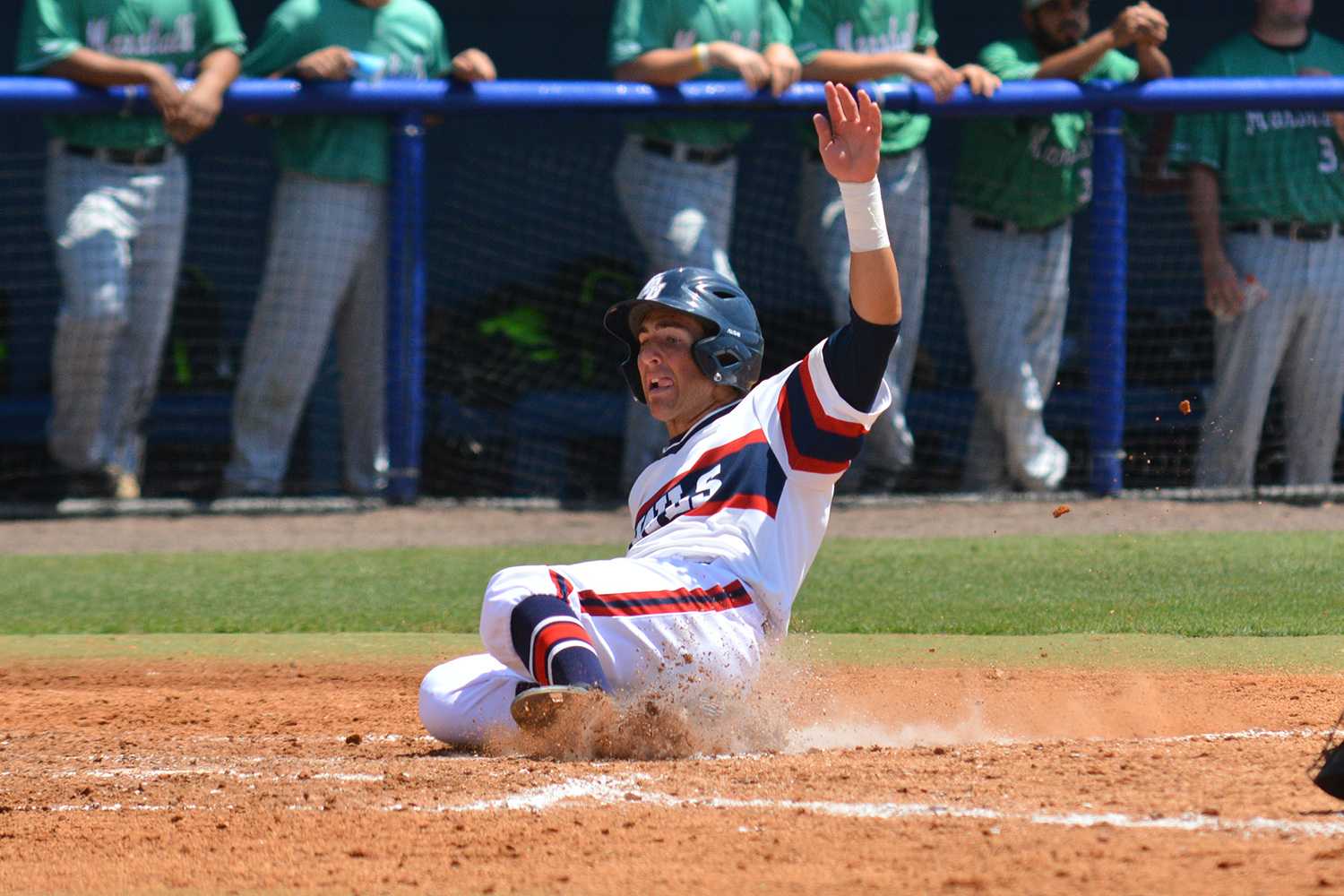 Junior second baseman Bret Lashley scores in Sunday’s noon victory over Marshall. Usually starting at first base, Lashley was moved over to second base this series due to an injury to sophomore Stephen Kerr. Marshall Friswell | Associate Editor 