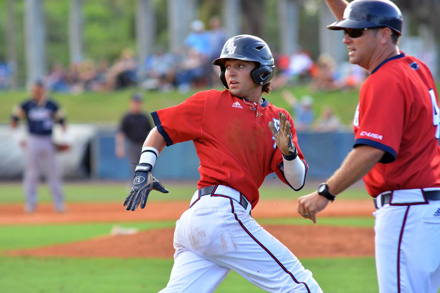 Second baseman Stephen Kerr rounds third as he adds to the Owls scoreboard. Kerr scored two runs and had two hits in four at bats to assist in the victory over FIU. Michelle Friswell | Associate Editor 