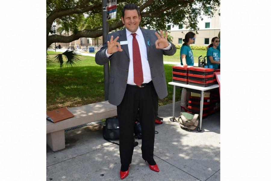 Director of Housing Larry Faerman at an April 2015 event dubbed “Walk A Mile in Her Shoes,” put together by OwlsCare to 
promote Sexual Assault Awareness Month. Photo courtesy of Larry Faerman